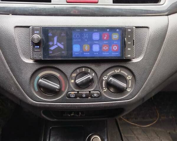 Серый Мицубиси Лансер, объемом двигателя 1.6 л и пробегом 260 тыс. км за 2750 $, фото 6 на Automoto.ua