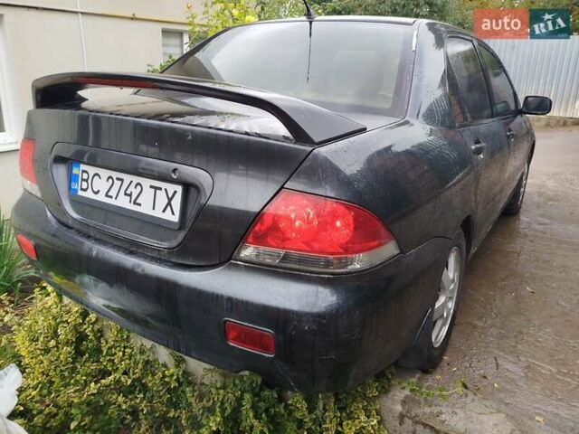 Сірий Міцубісі Lancer, об'ємом двигуна 1.6 л та пробігом 260 тис. км за 2799 $, фото 1 на Automoto.ua
