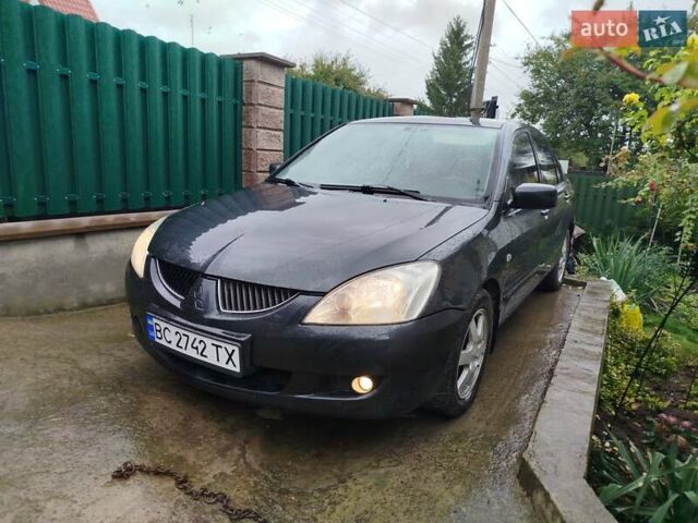 Серый Мицубиси Лансер, объемом двигателя 1.6 л и пробегом 260 тыс. км за 2750 $, фото 3 на Automoto.ua