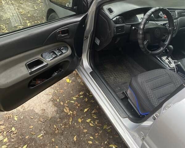 Мицубиси Лансер 2003 в Белой Церкве на Automoto.ua Серый Мицубиси Лансер, объемом двигателя 1.58 л и пробегом 350 тыс. км за 3300 $, фото 11 на Automoto.ua