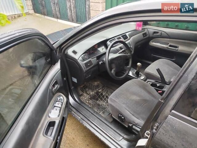 Серый Мицубиси Лансер, объемом двигателя 1.6 л и пробегом 260 тыс. км за 2750 $, фото 8 на Automoto.ua