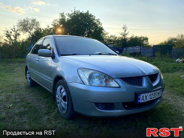 Сірий Міцубісі Lancer, об'ємом двигуна 1.6 л та пробігом 390 тис. км за 4400 $, фото 1 на Automoto.ua