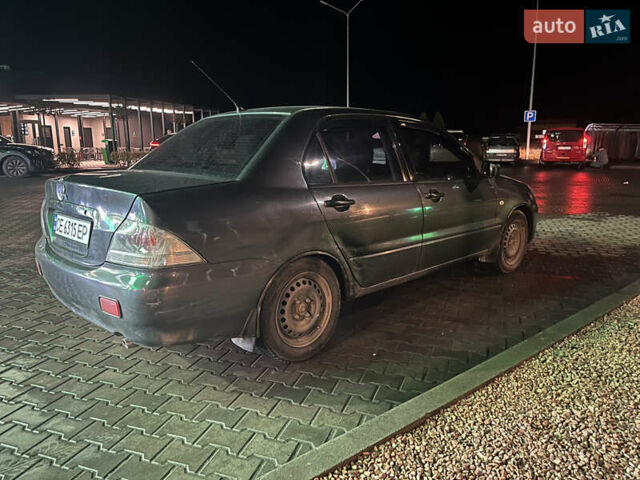 Сірий Міцубісі Lancer, об'ємом двигуна 1.58 л та пробігом 232 тис. км за 2899 $, фото 7 на Automoto.ua