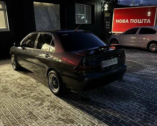 Сірий Міцубісі Lancer, об'ємом двигуна 1.6 л та пробігом 272 тис. км за 5100 $, фото 4 на Automoto.ua