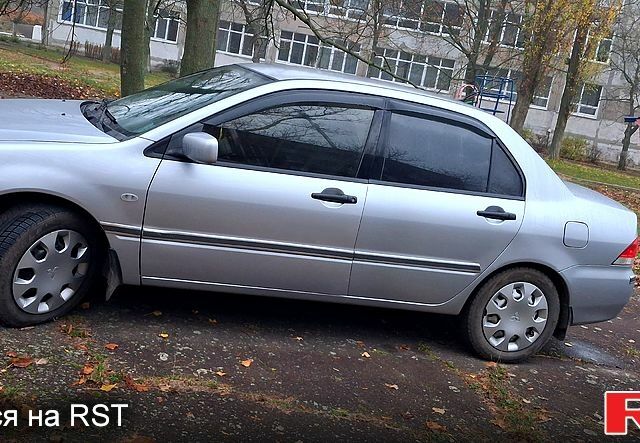 Сірий Міцубісі Lancer, об'ємом двигуна 1.6 л та пробігом 213 тис. км за 4400 $, фото 1 на Automoto.ua