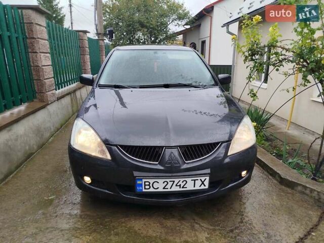 Серый Мицубиси Лансер, объемом двигателя 1.6 л и пробегом 260 тыс. км за 2750 $, фото 9 на Automoto.ua