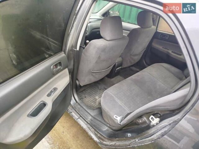 Серый Мицубиси Лансер, объемом двигателя 1.6 л и пробегом 260 тыс. км за 2750 $, фото 4 на Automoto.ua