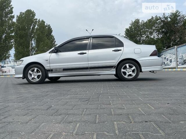 Сірий Міцубісі Lancer, об'ємом двигуна 2 л та пробігом 190 тис. км за 4500 $, фото 23 на Automoto.ua