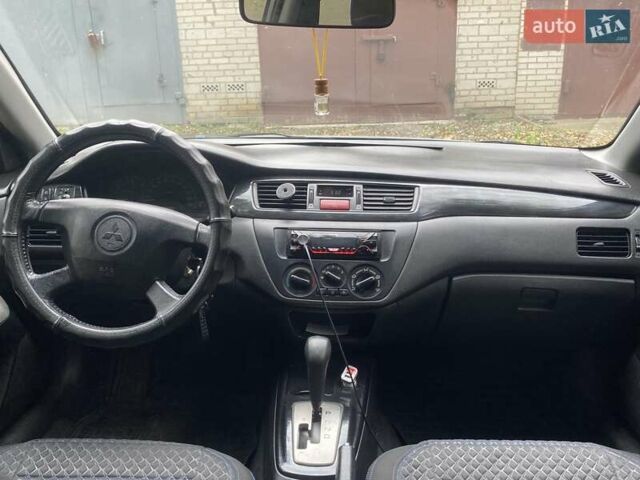 Мицубиси Лансер 2003 в Белой Церкве на Automoto.ua Серый Мицубиси Лансер, объемом двигателя 1.58 л и пробегом 350 тыс. км за 3300 $, фото 14 на Automoto.ua