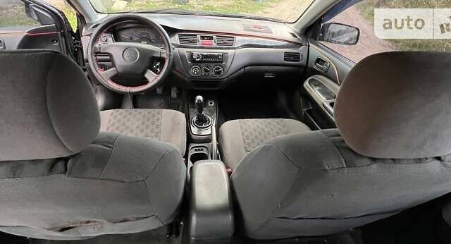Сірий Міцубісі Lancer, об'ємом двигуна 1.58 л та пробігом 232 тис. км за 2899 $, фото 28 на Automoto.ua