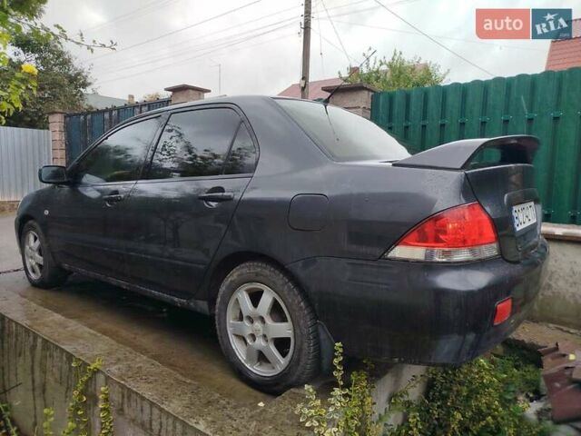 Серый Мицубиси Лансер, объемом двигателя 1.6 л и пробегом 260 тыс. км за 2750 $, фото 1 на Automoto.ua