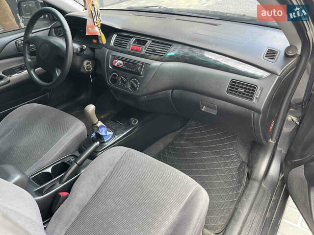 Сірий Міцубісі Lancer, об'ємом двигуна 1.6 л та пробігом 250 тис. км за 3300 $, фото 11 на Automoto.ua
