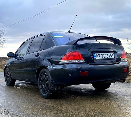 Сірий Міцубісі Lancer, об'ємом двигуна 1.6 л та пробігом 350 тис. км за 3200 $, фото 6 на Automoto.ua