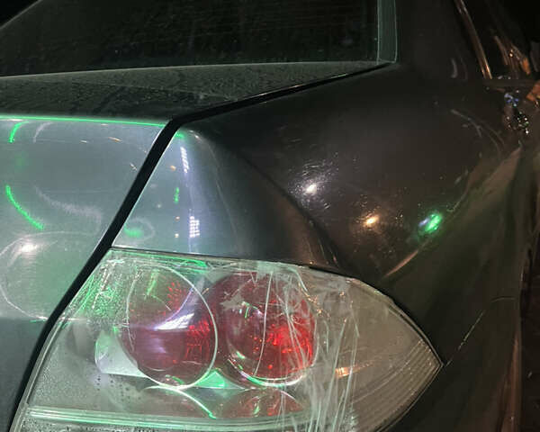 Сірий Міцубісі Lancer, об'ємом двигуна 1.58 л та пробігом 232 тис. км за 2899 $, фото 3 на Automoto.ua