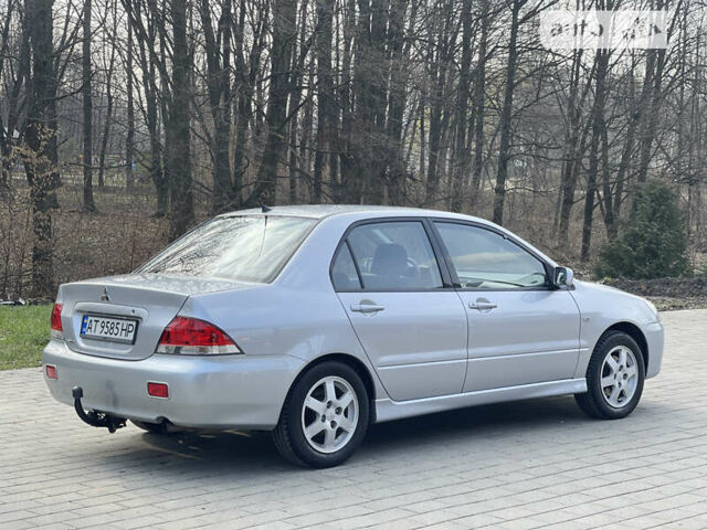 Сірий Міцубісі Lancer, об'ємом двигуна 1.58 л та пробігом 168 тис. км за 4950 $, фото 1 на Automoto.ua