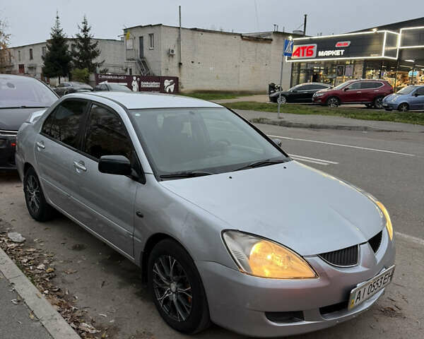 Сірий Міцубісі Lancer, об'ємом двигуна 1.58 л та пробігом 299 тис. км за 3850 $, фото 1 на Automoto.ua