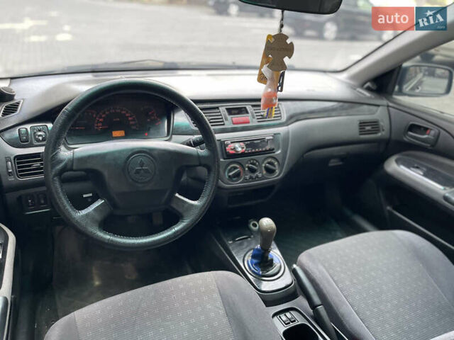 Сірий Міцубісі Lancer, об'ємом двигуна 1.6 л та пробігом 250 тис. км за 3300 $, фото 4 на Automoto.ua