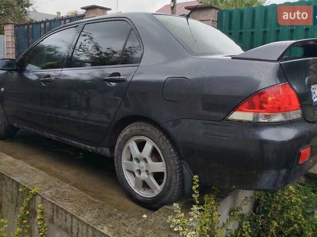 Сірий Міцубісі Lancer, об'ємом двигуна 1.6 л та пробігом 260 тис. км за 2799 $, фото 9 на Automoto.ua