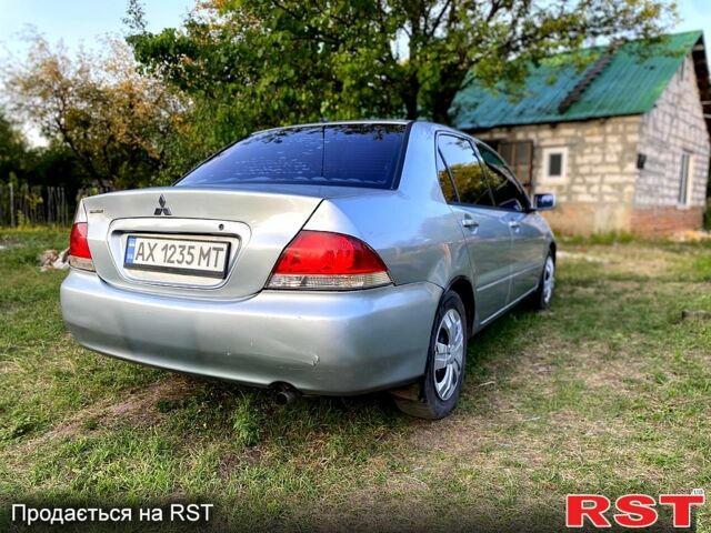 Сірий Міцубісі Lancer, об'ємом двигуна 1.6 л та пробігом 390 тис. км за 4400 $, фото 4 на Automoto.ua