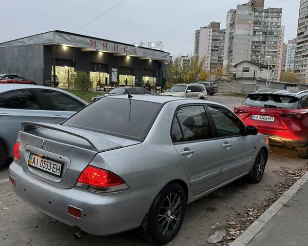 Сірий Міцубісі Lancer, об'ємом двигуна 1.58 л та пробігом 299 тис. км за 3850 $, фото 2 на Automoto.ua