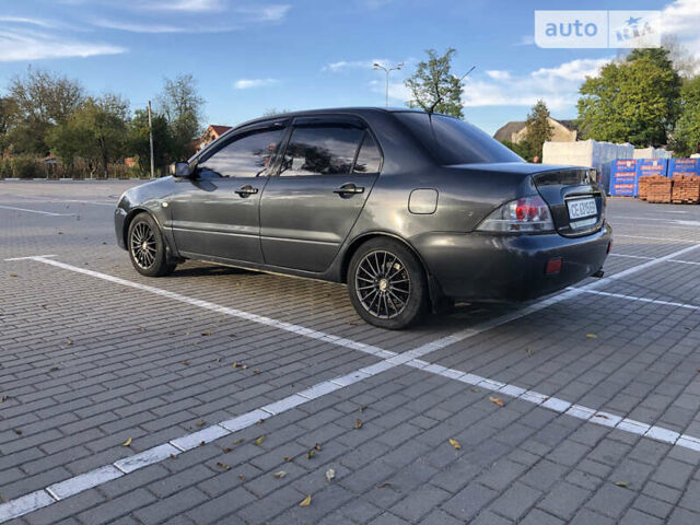 Сірий Міцубісі Lancer, об'ємом двигуна 1.58 л та пробігом 232 тис. км за 2899 $, фото 14 на Automoto.ua
