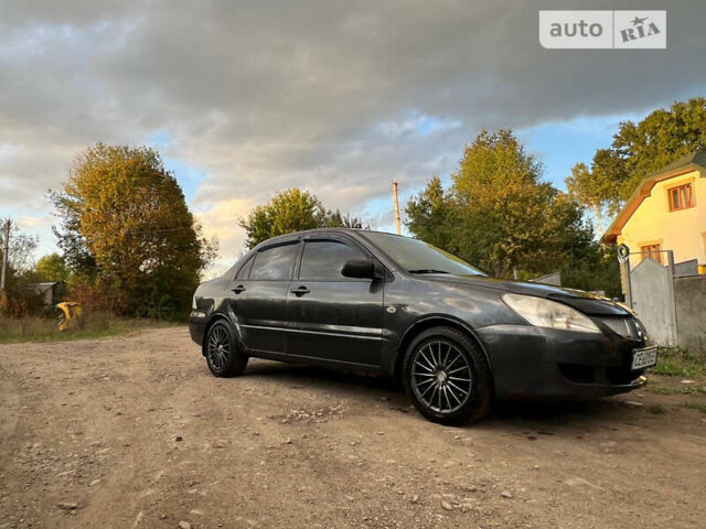 Сірий Міцубісі Lancer, об'ємом двигуна 1.58 л та пробігом 232 тис. км за 2899 $, фото 23 на Automoto.ua