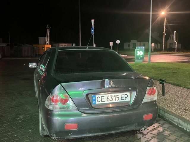 Серый Мицубиси Лансер, объемом двигателя 1.6 л и пробегом 269 тыс. км за 2999 $, фото 4 на Automoto.ua