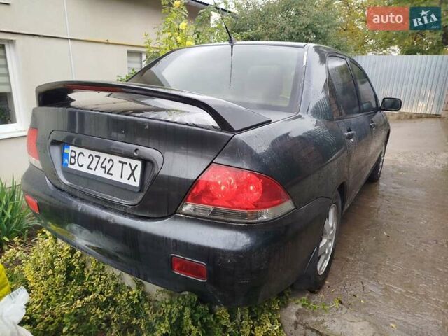 Серый Мицубиси Лансер, объемом двигателя 1.6 л и пробегом 260 тыс. км за 2750 $, фото 5 на Automoto.ua