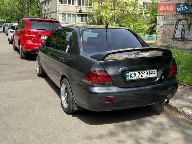 Сірий Міцубісі Lancer, об'ємом двигуна 1.6 л та пробігом 272 тис. км за 5100 $, фото 1 на Automoto.ua