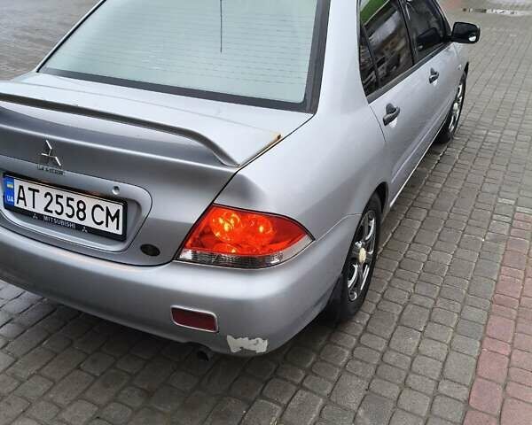 Сірий Міцубісі Lancer, об'ємом двигуна 1.58 л та пробігом 320 тис. км за 3700 $, фото 13 на Automoto.ua