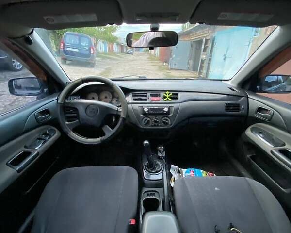 Сірий Міцубісі Lancer, об'ємом двигуна 1.58 л та пробігом 307 тис. км за 3800 $, фото 7 на Automoto.ua