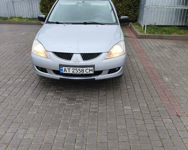 Сірий Міцубісі Lancer, об'ємом двигуна 1.58 л та пробігом 320 тис. км за 3700 $, фото 2 на Automoto.ua