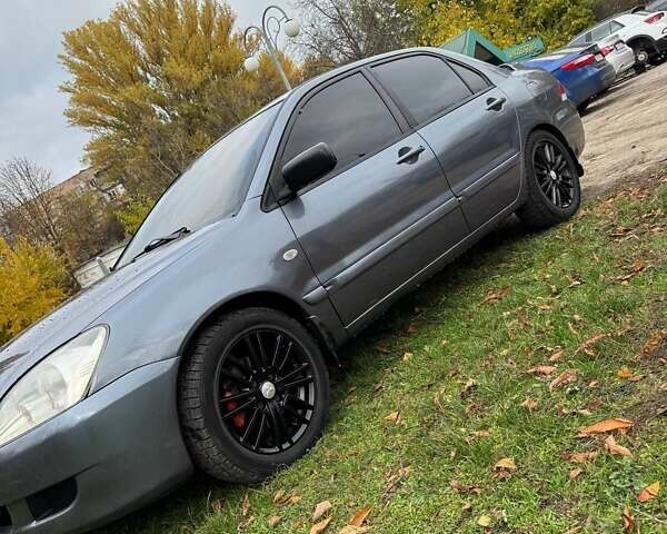 Серый Мицубиси Лансер, объемом двигателя 1.58 л и пробегом 313 тыс. км за 4650 $, фото 5 на Automoto.ua