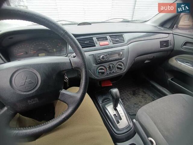 Серый Мицубиси Лансер, объемом двигателя 1.58 л и пробегом 300 тыс. км за 2550 $, фото 3 на Automoto.ua