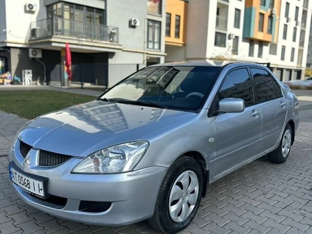Сірий Міцубісі Lancer, об'ємом двигуна 1.59 л та пробігом 200 тис. км за 1899 $, фото 1 на Automoto.ua