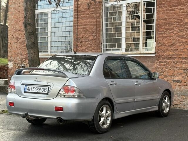 Серый Мицубиси Лансер, объемом двигателя 2 л и пробегом 180 тыс. км за 3700 $, фото 4 на Automoto.ua