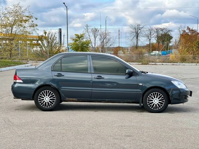 Серый Мицубиси Лансер, объемом двигателя 1.6 л и пробегом 490 тыс. км за 1799 $, фото 4 на Automoto.ua