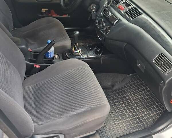 Сірий Міцубісі Lancer, об'ємом двигуна 1.58 л та пробігом 222 тис. км за 4000 $, фото 6 на Automoto.ua
