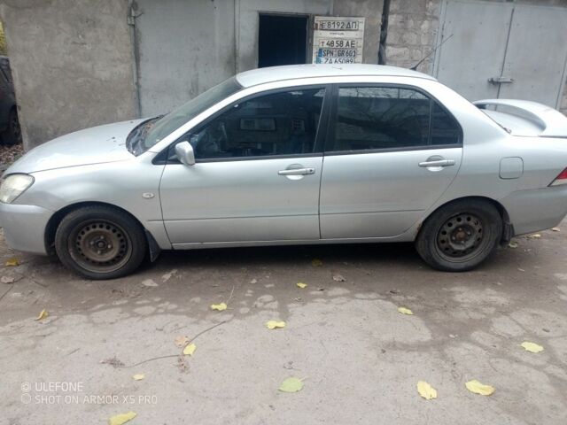 Серый Мицубиси Лансер, объемом двигателя 1.6 л и пробегом 320 тыс. км за 2851 $, фото 2 на Automoto.ua