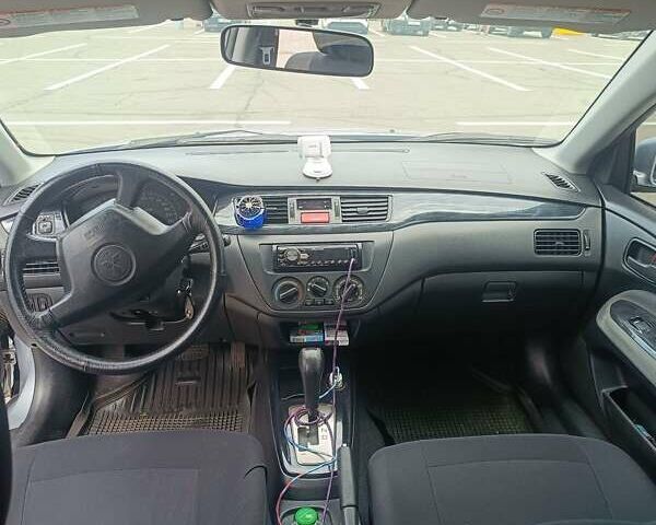 Сірий Міцубісі Lancer, об'ємом двигуна 1.6 л та пробігом 242 тис. км за 4300 $, фото 7 на Automoto.ua