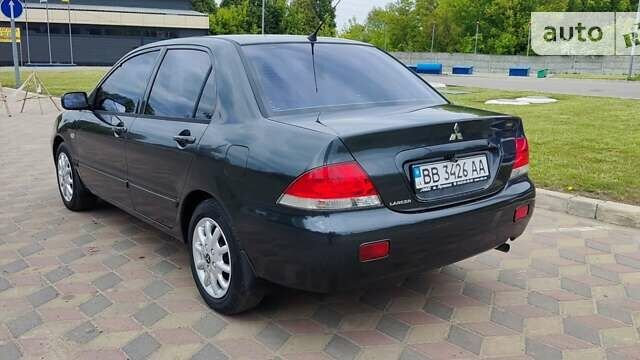 Сірий Міцубісі Lancer, об'ємом двигуна 1.6 л та пробігом 211 тис. км за 3800 $, фото 6 на Automoto.ua