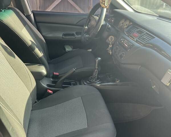 Сірий Міцубісі Lancer, об'ємом двигуна 1.58 л та пробігом 262 тис. км за 3900 $, фото 7 на Automoto.ua
