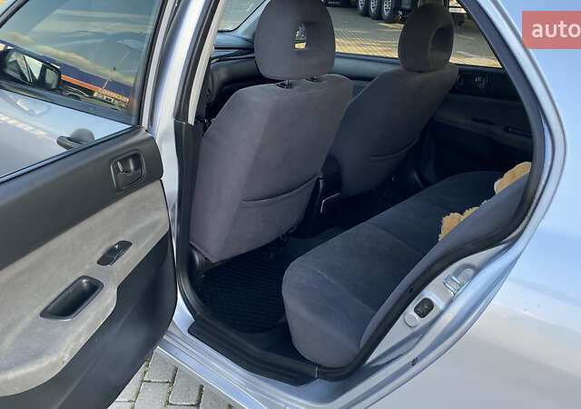 Сірий Міцубісі Lancer, об'ємом двигуна 1.58 л та пробігом 270 тис. км за 1999 $, фото 15 на Automoto.ua