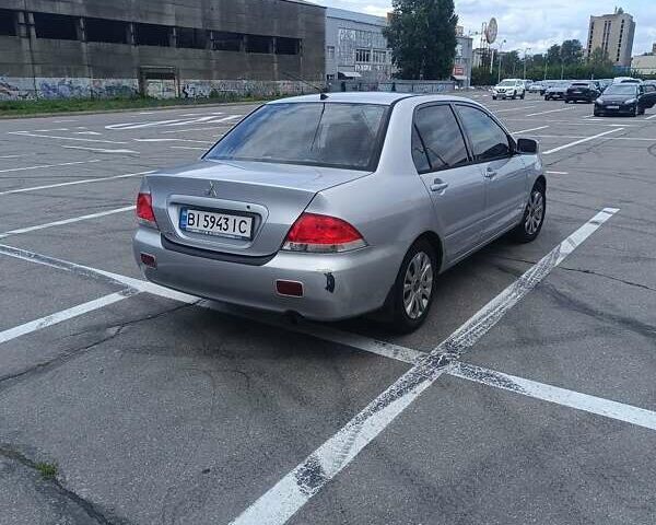 Сірий Міцубісі Lancer, об'ємом двигуна 1.6 л та пробігом 242 тис. км за 4300 $, фото 4 на Automoto.ua