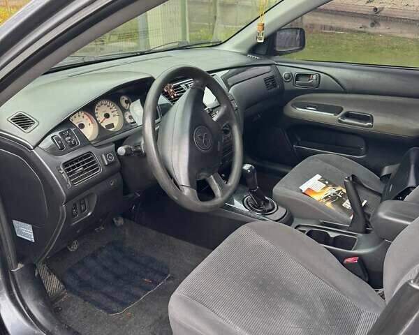 Серый Мицубиси Лансер, объемом двигателя 1.58 л и пробегом 313 тыс. км за 4650 $, фото 2 на Automoto.ua