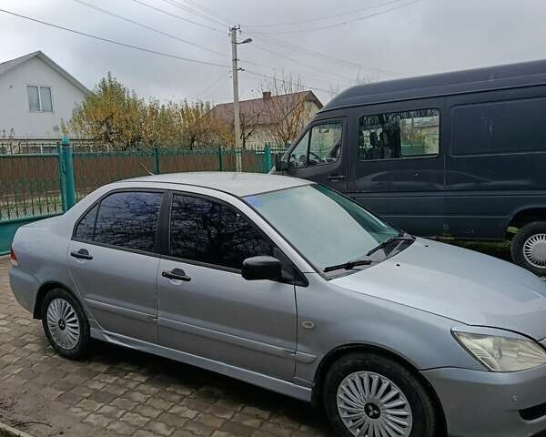 Сірий Міцубісі Lancer, об'ємом двигуна 1.58 л та пробігом 439 тис. км за 2500 $, фото 2 на Automoto.ua