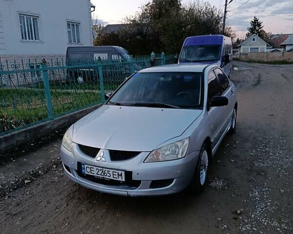 Мицубиси Лансер 2004 в Черновцах на Automoto.ua Серый Мицубиси Лансер, объемом двигателя 1.58 л и пробегом 439 тыс. км за 2750 $, фото 22 на Automoto.ua