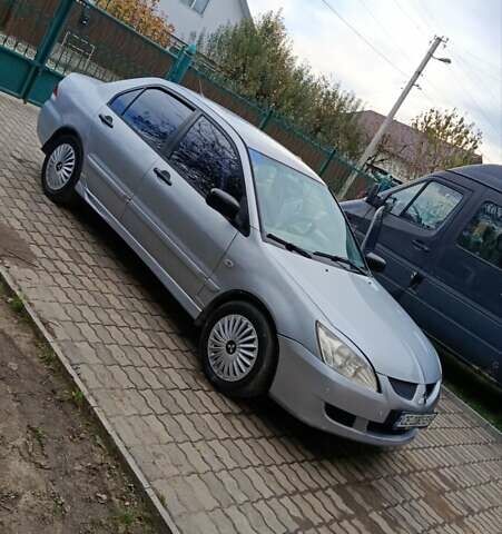 Сірий Міцубісі Lancer, об'ємом двигуна 1.58 л та пробігом 439 тис. км за 2500 $, фото 7 на Automoto.ua