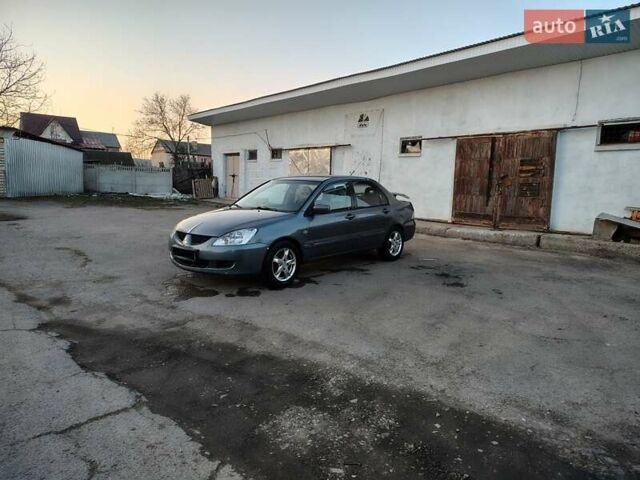 Сірий Міцубісі Lancer, об'ємом двигуна 1.58 л та пробігом 300 тис. км за 4200 $, фото 13 на Automoto.ua