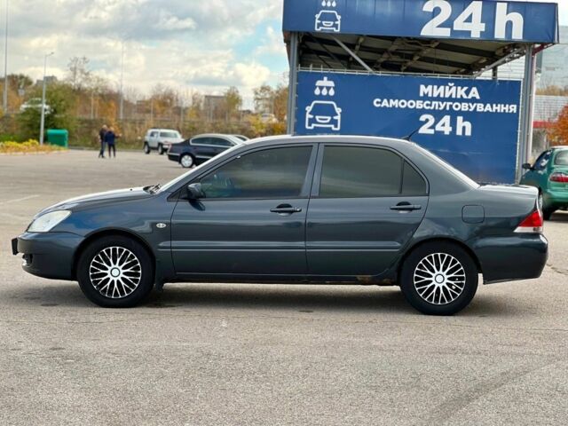 Серый Мицубиси Лансер, объемом двигателя 1.6 л и пробегом 490 тыс. км за 1799 $, фото 5 на Automoto.ua